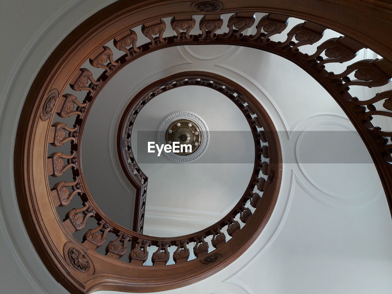 Directly below shot of spiral staircase in building