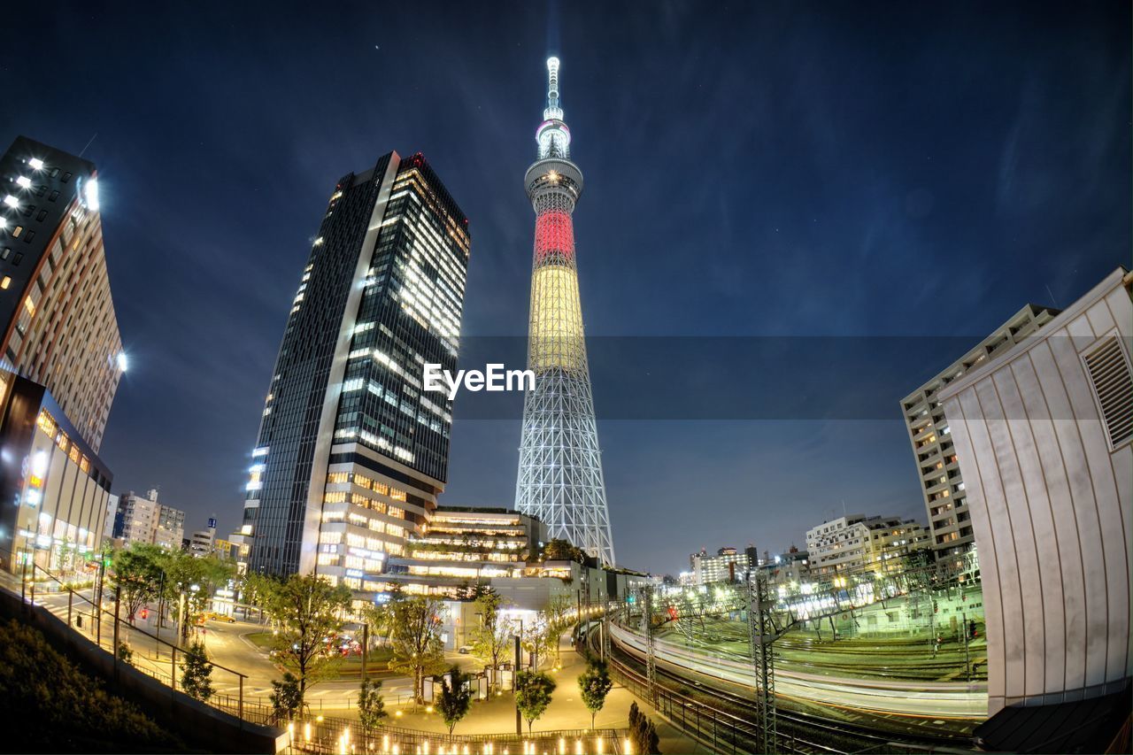 ILLUMINATED CITYSCAPE AT NIGHT