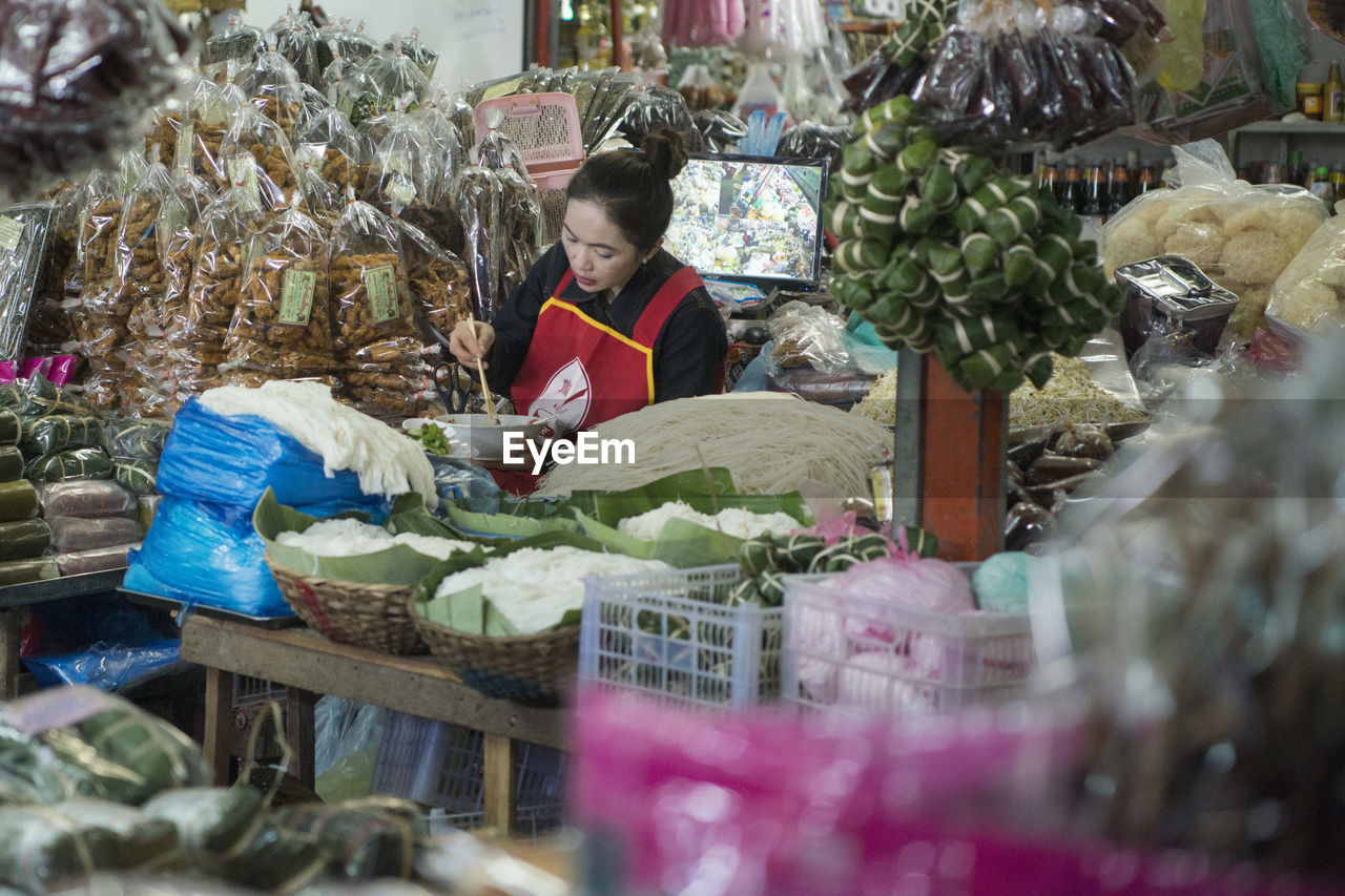 MAN WORKING IN STORE