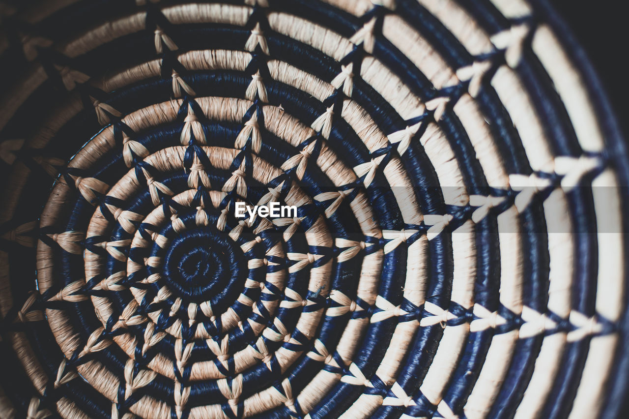 DIRECTLY BELOW SHOT OF SPIRAL STAIRCASE IN CEILING