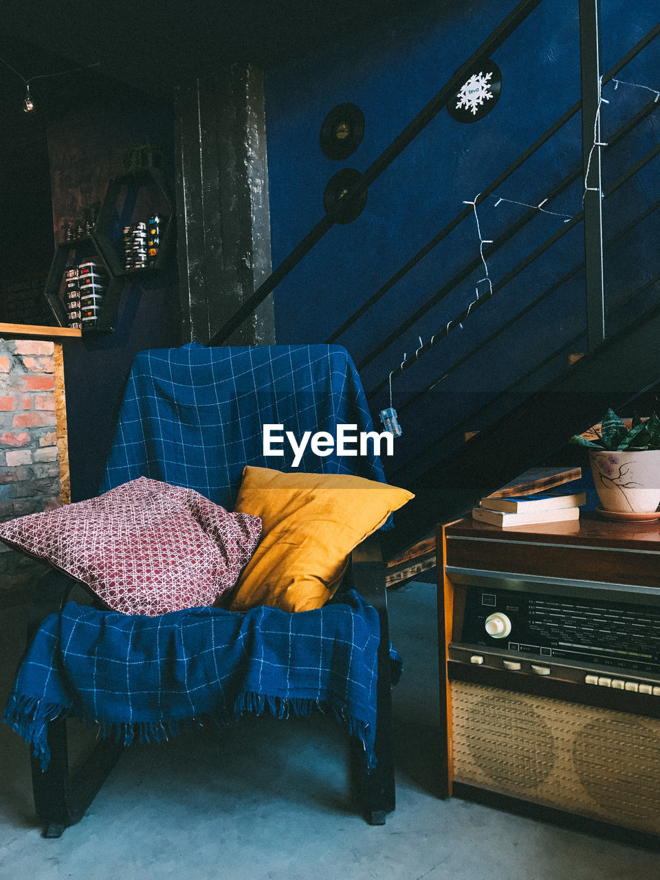 High angle view of pillow on chair at home