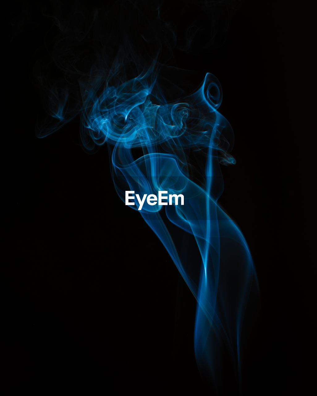 Close-up of incense smoke against black background