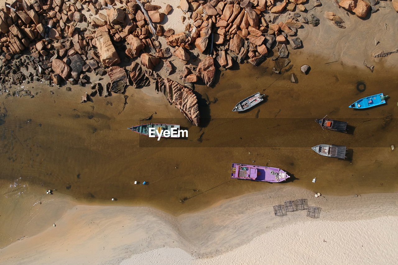 High angle view of boats at beach on sunny day