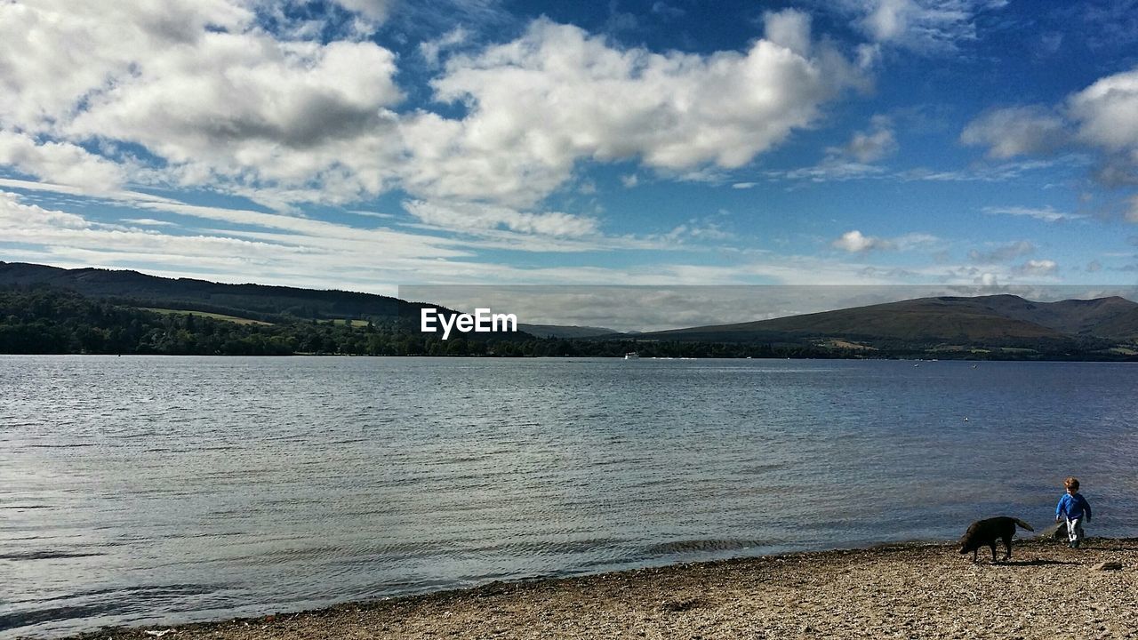 SCENIC VIEW OF LAKE AND MOUNTAINS