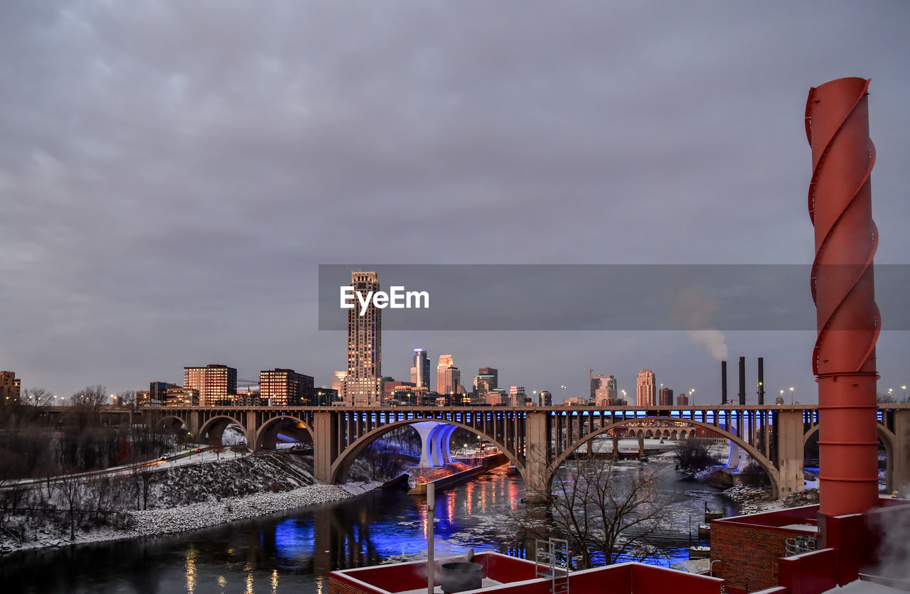 Downtown winter skyline along the river at sunrise