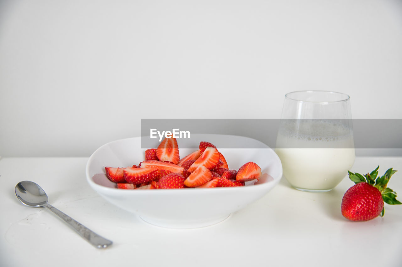 High angle view of breakfast on table against white background