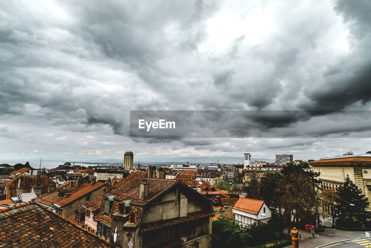 View of town against cloudy sky