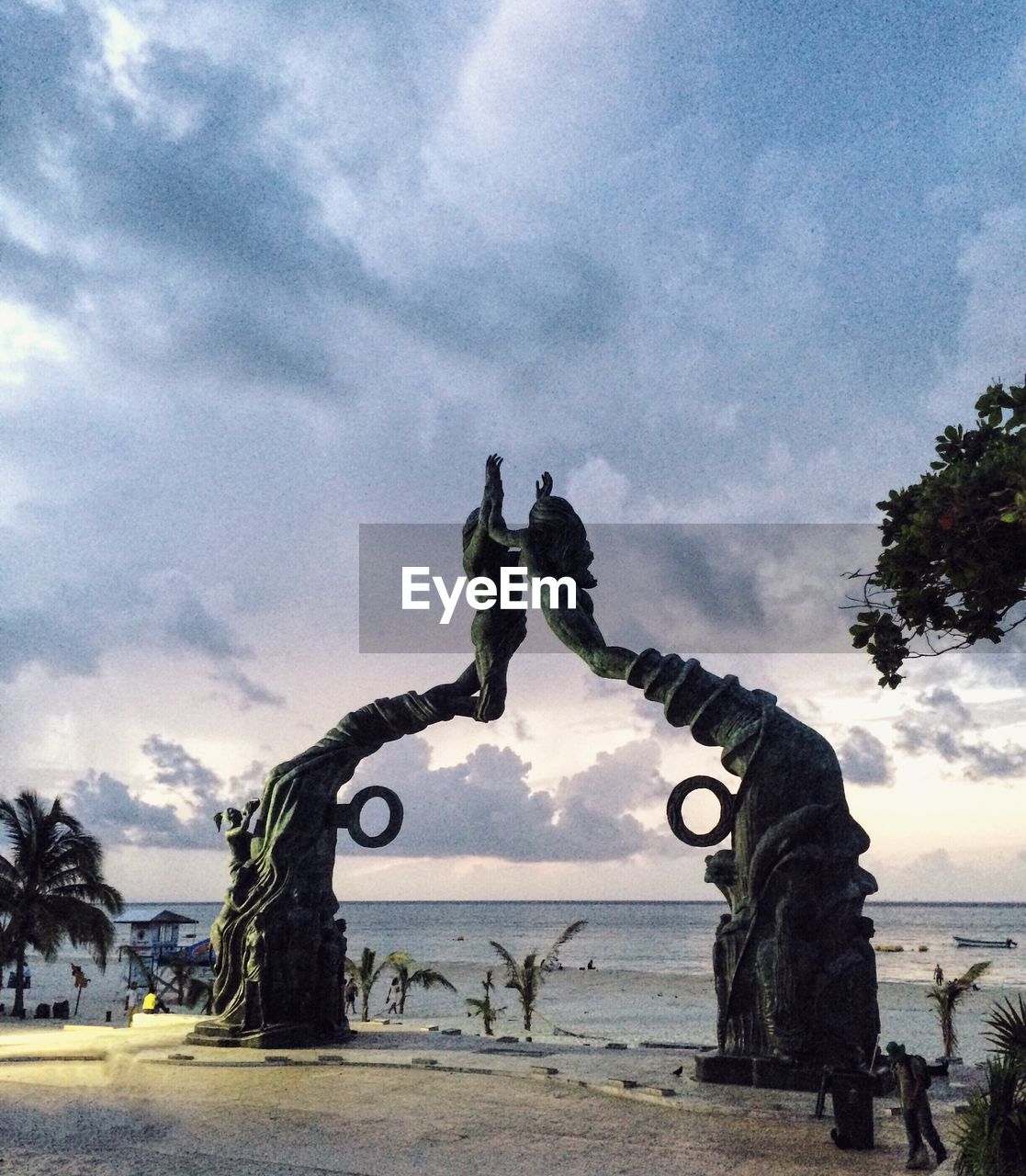 STATUE AGAINST SEA AND SKY