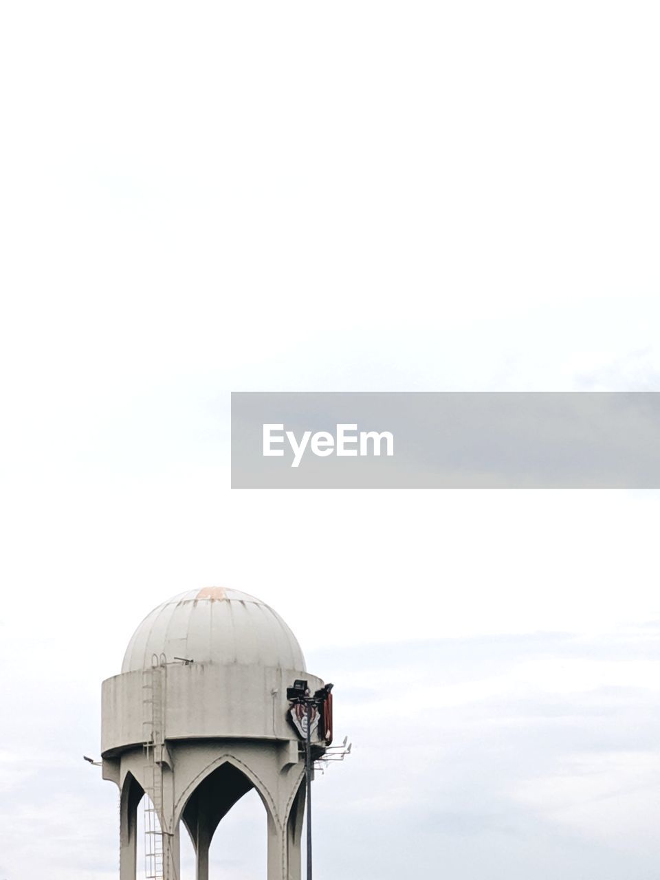 HIGH SECTION OF CHURCH AGAINST CLOUDY SKY