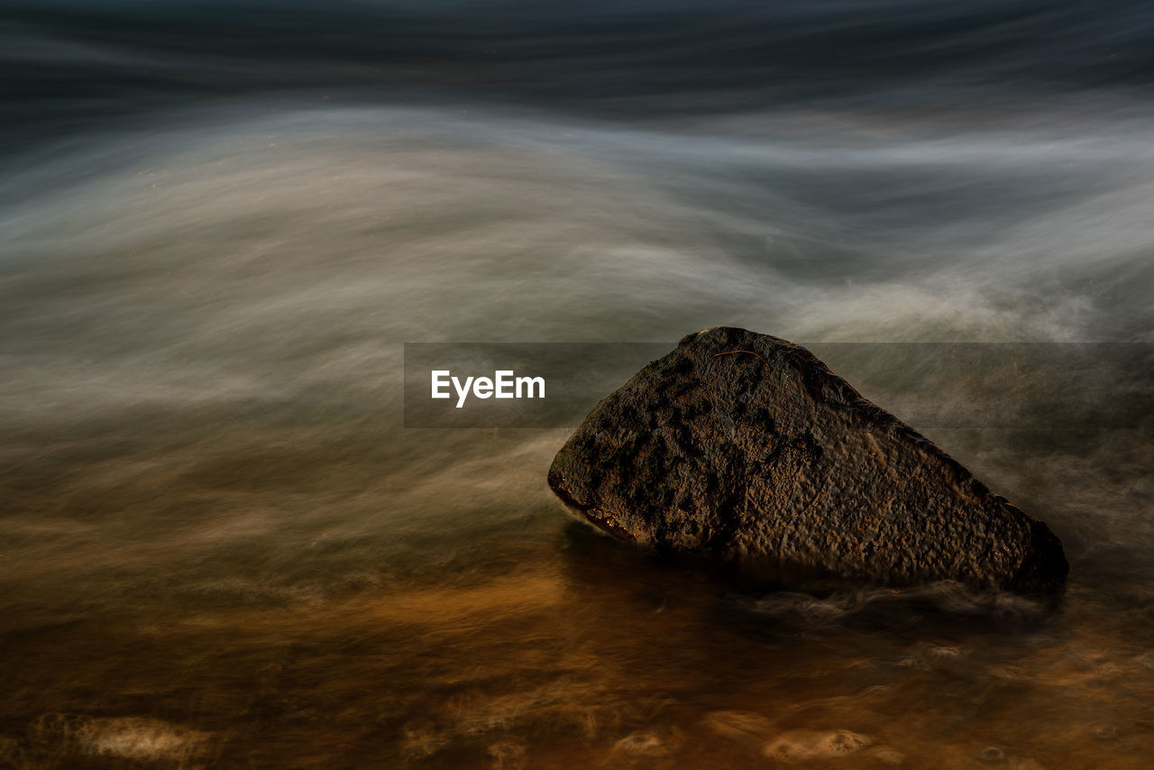 High angle view of rock formation in sea