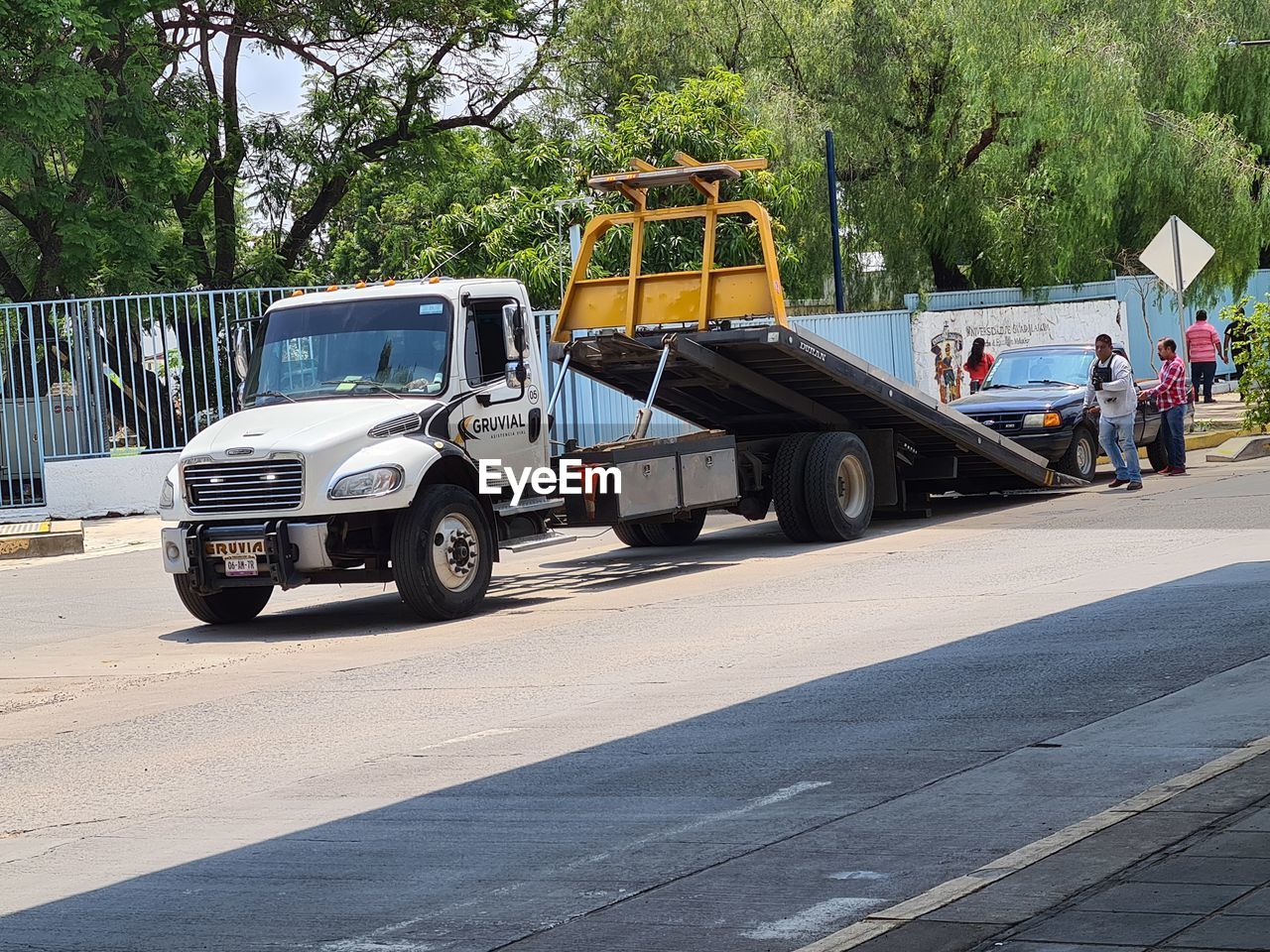 transportation, mode of transportation, asphalt, transport, land vehicle, vehicle, tree, road, motor vehicle, car, day, plant, city, street, truck, commercial land vehicle, nature, occupation, working, industry, men, outdoors