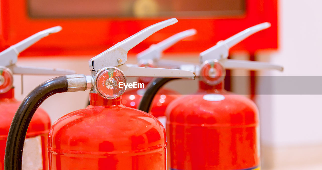 Close-up of red fire extinguishers