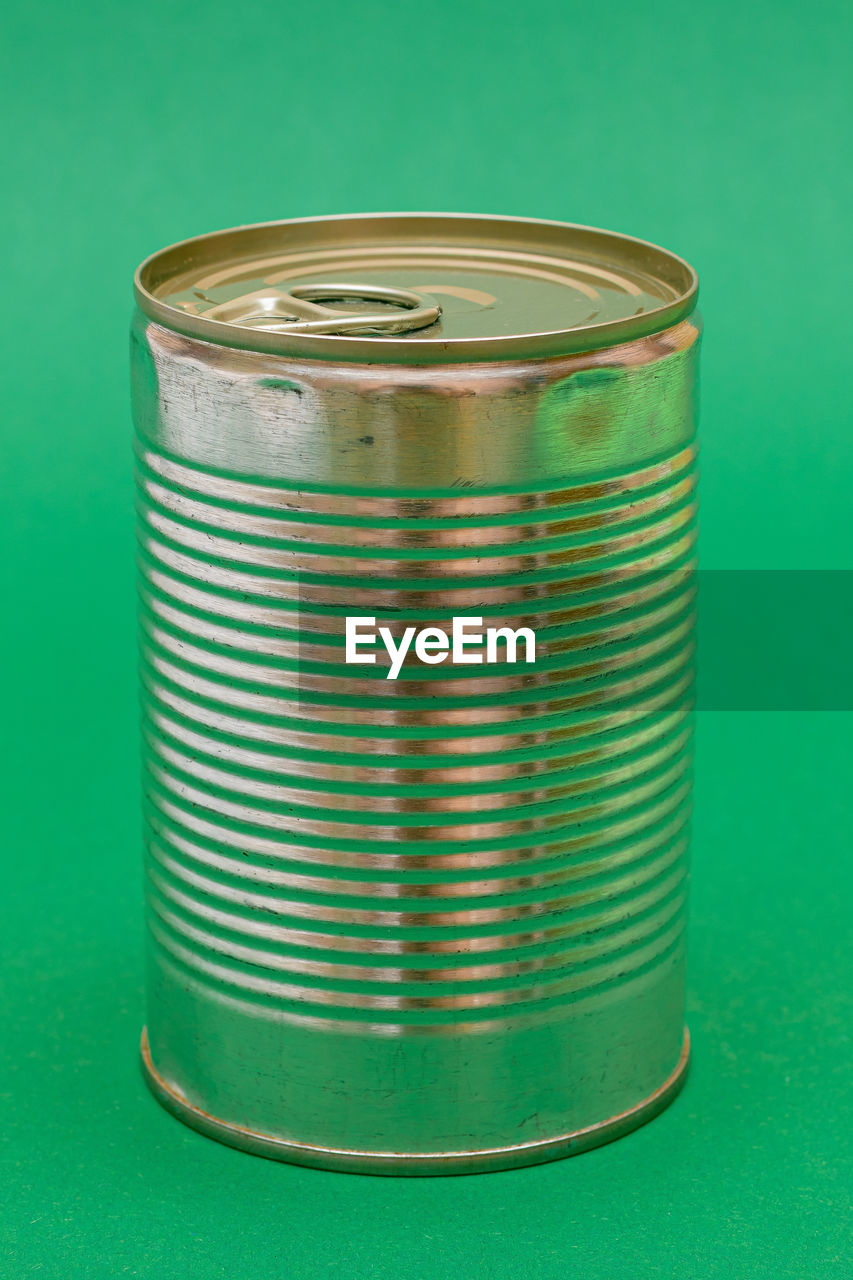 tin can, colored background, metal, can, green, studio shot, aluminum, green background, no people, tin, single object, indoors, cylinder, aluminum can, food and drink, recycling, container