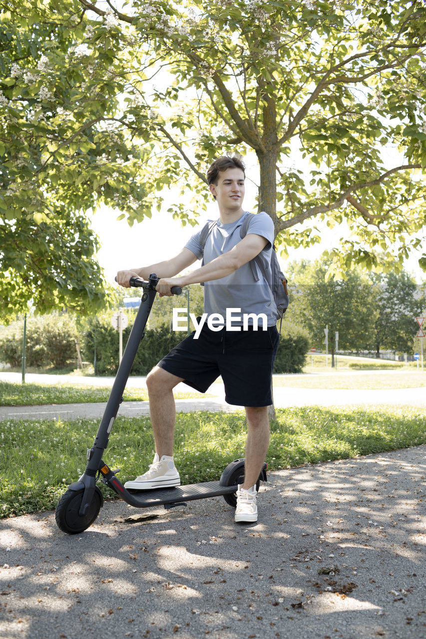 full length of man standing on golf course