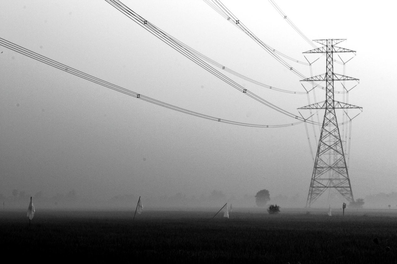 ELECTRICITY PYLONS ON FIELD