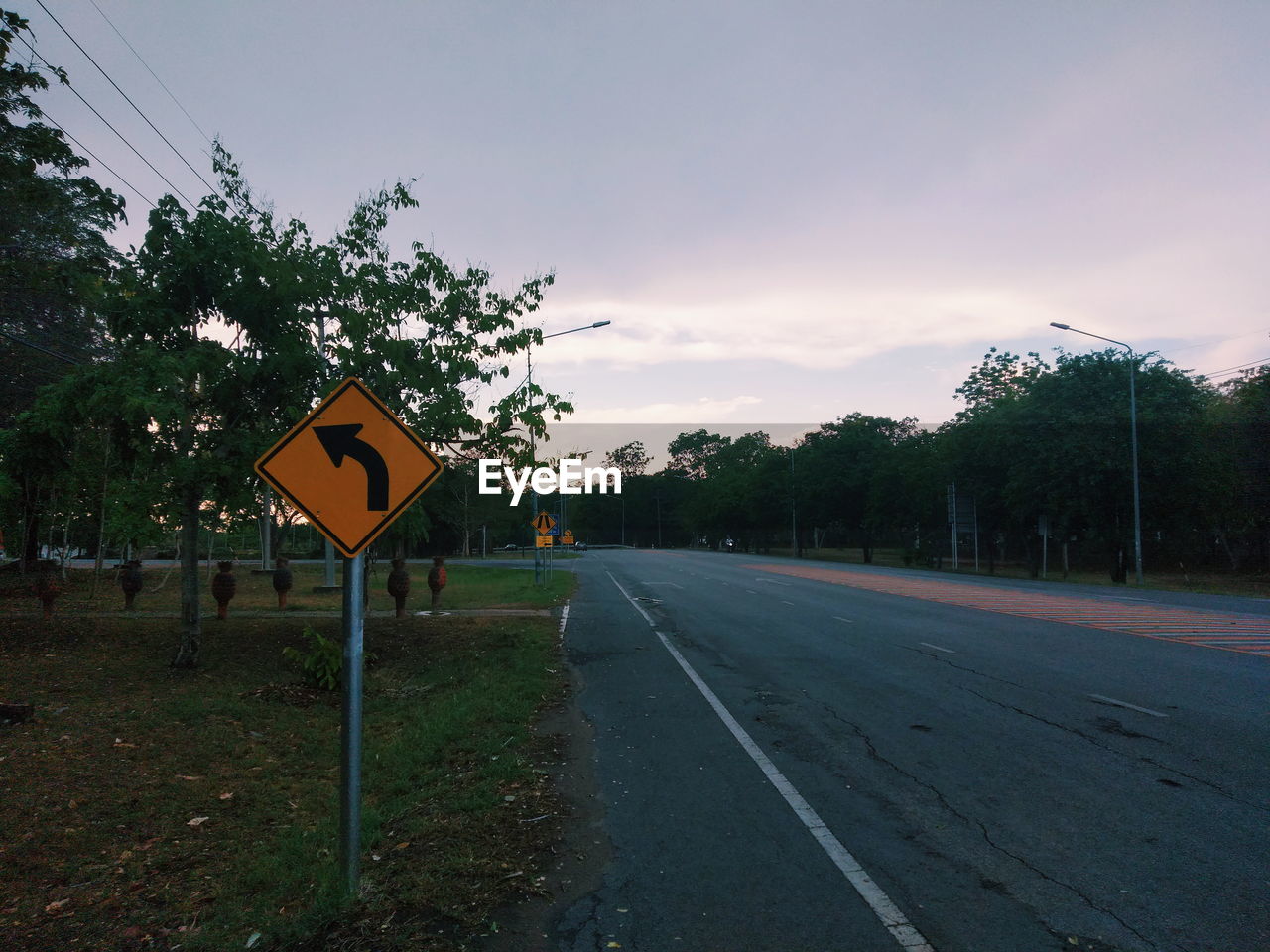 VIEW OF ROAD SIGN AGAINST TREES