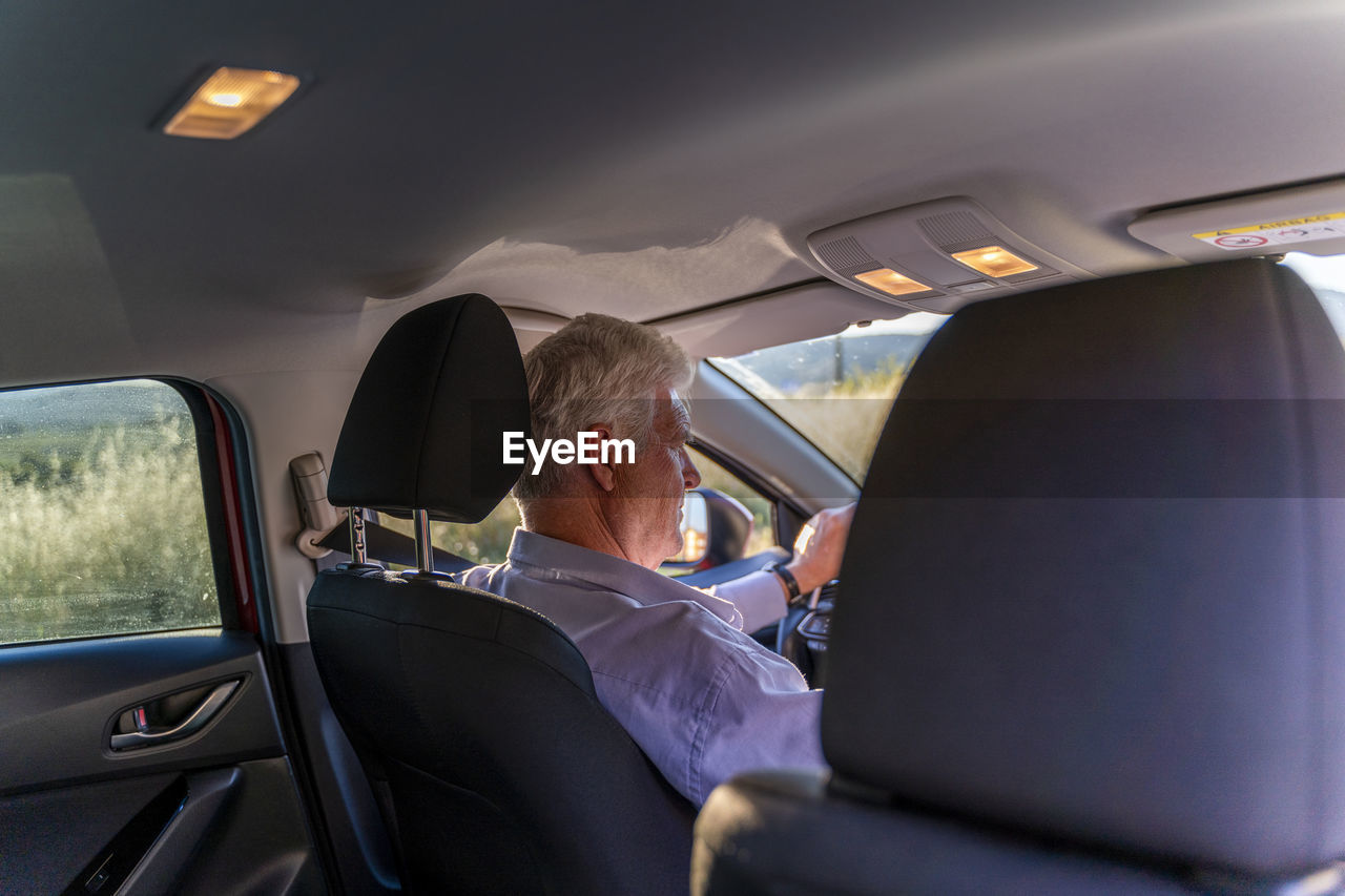 Senior man driving a car