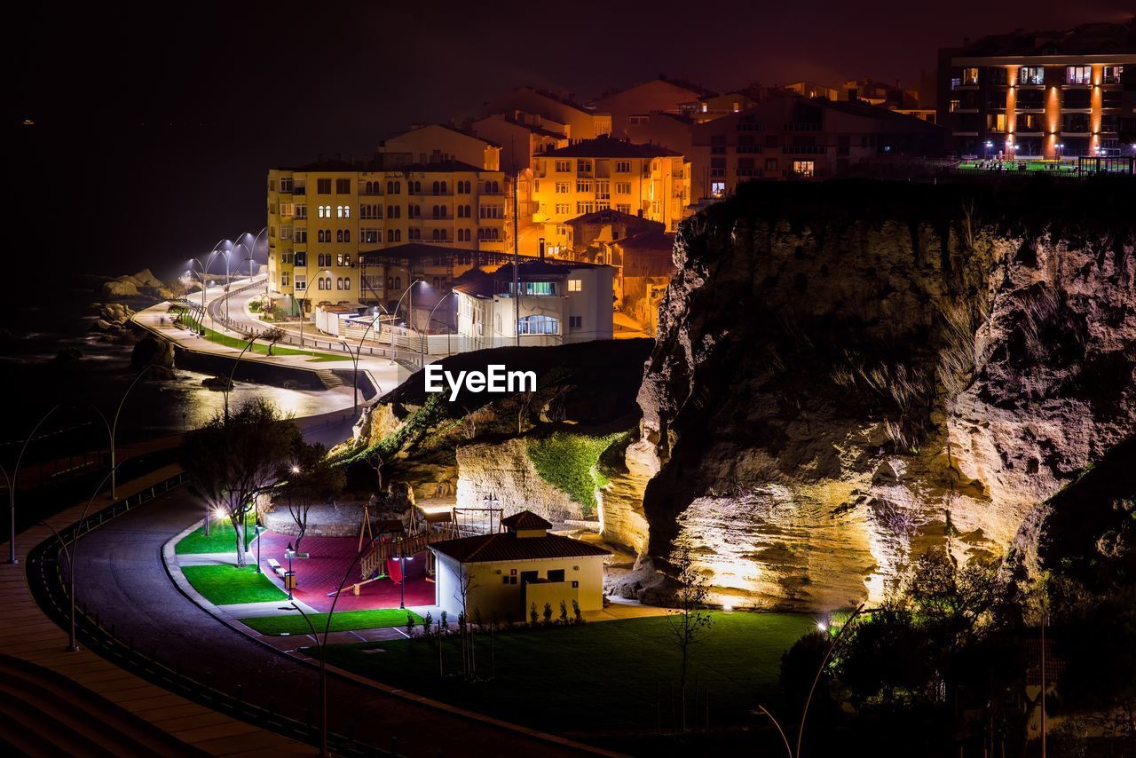 High angle view of illuminated buildings at night