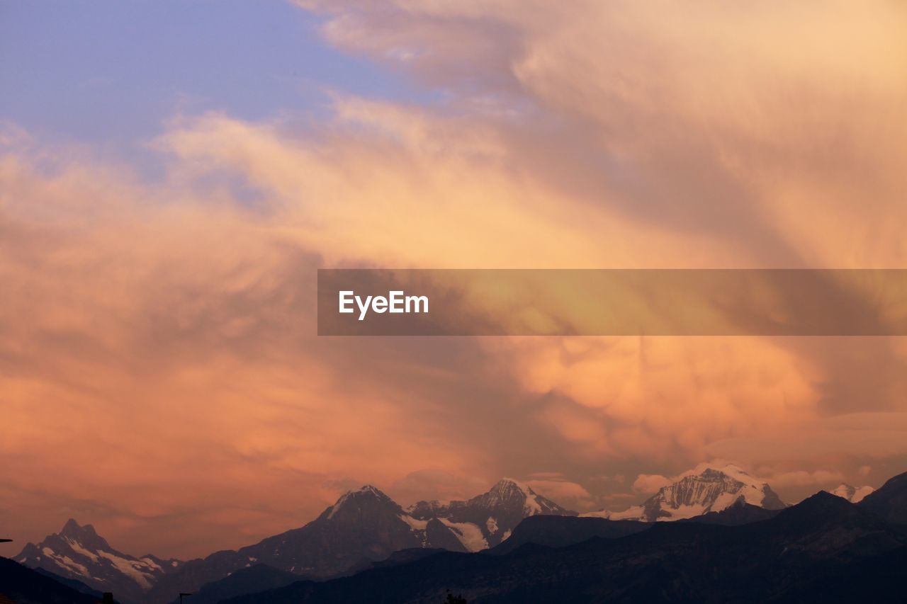 Scenic view of mountains against sky during sunset