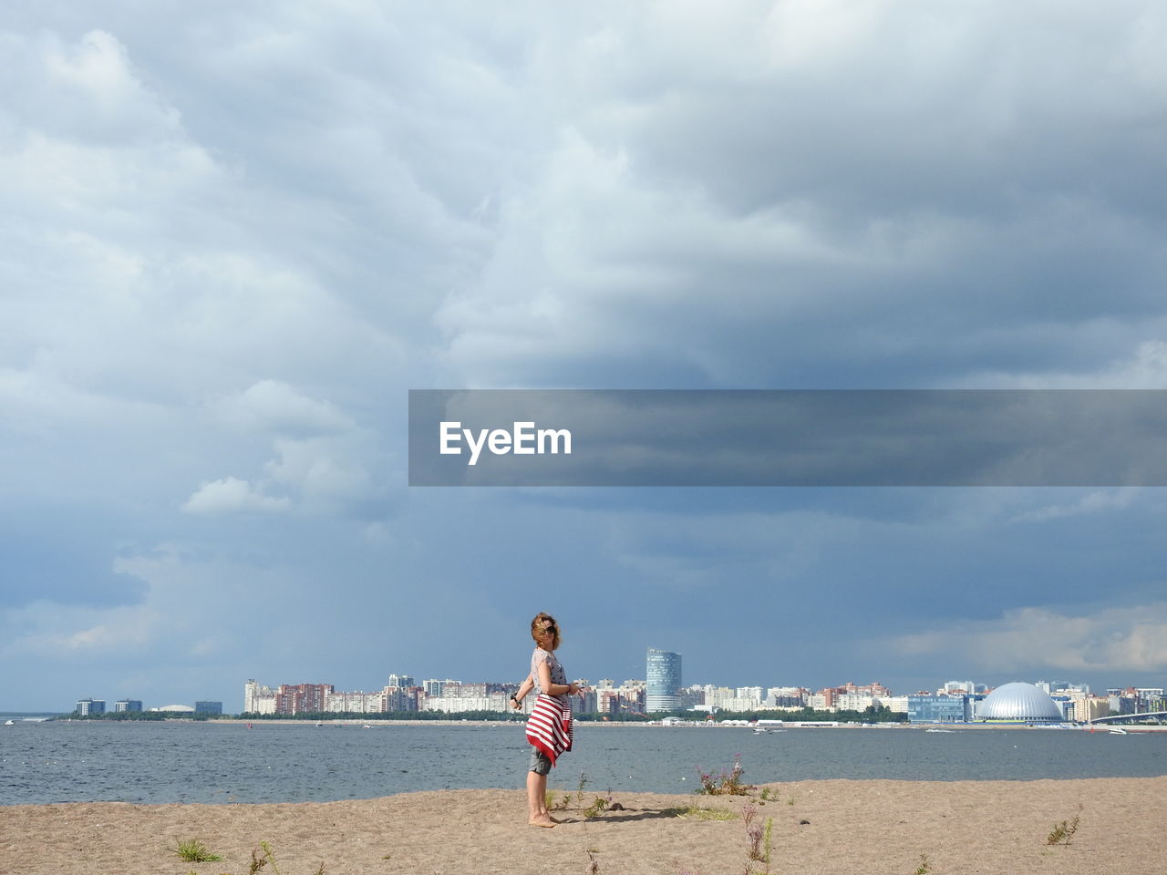 Beach view the gulf of finland clouds and city