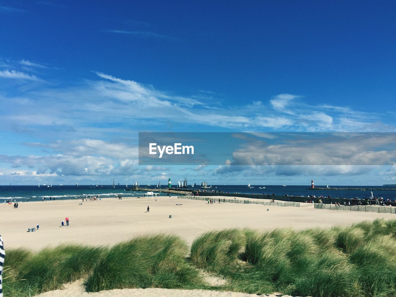 Scenic view of beach and baltic sea against sky on sunny day