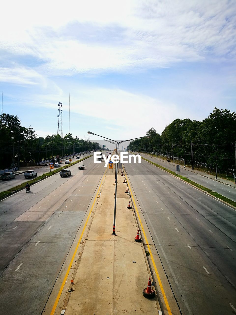 HIGH ANGLE VIEW OF ROAD AGAINST SKY