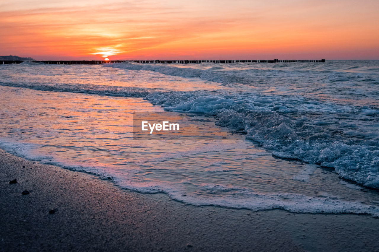 Scenic view of sea against sky during sunset