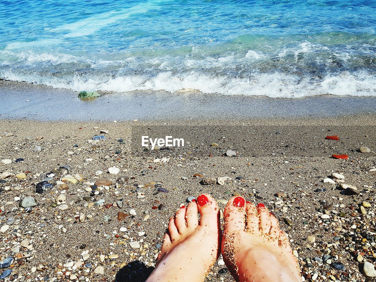 Low section of woman at beach