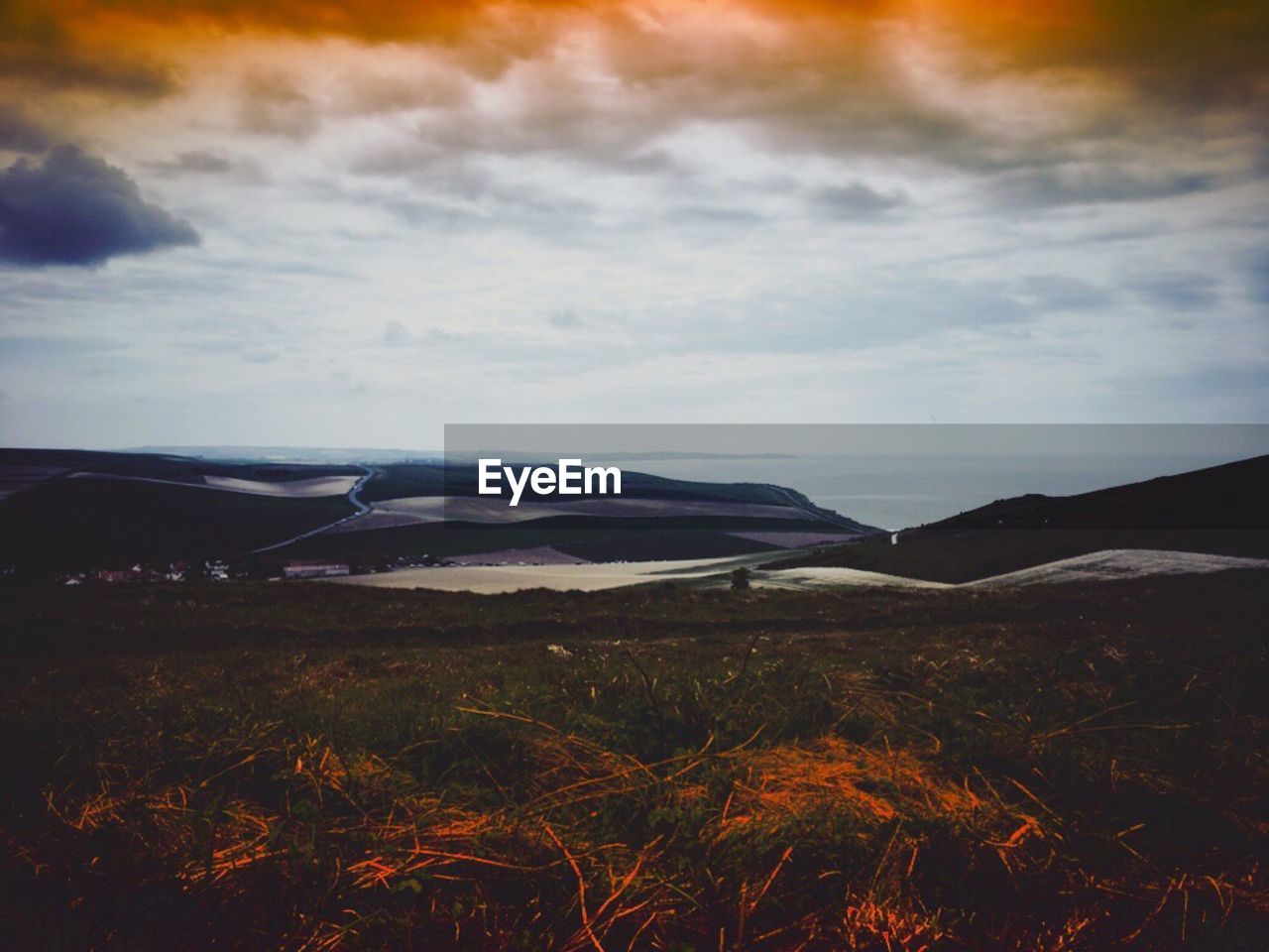 SCENIC VIEW OF LANDSCAPE AND MOUNTAINS AGAINST SKY