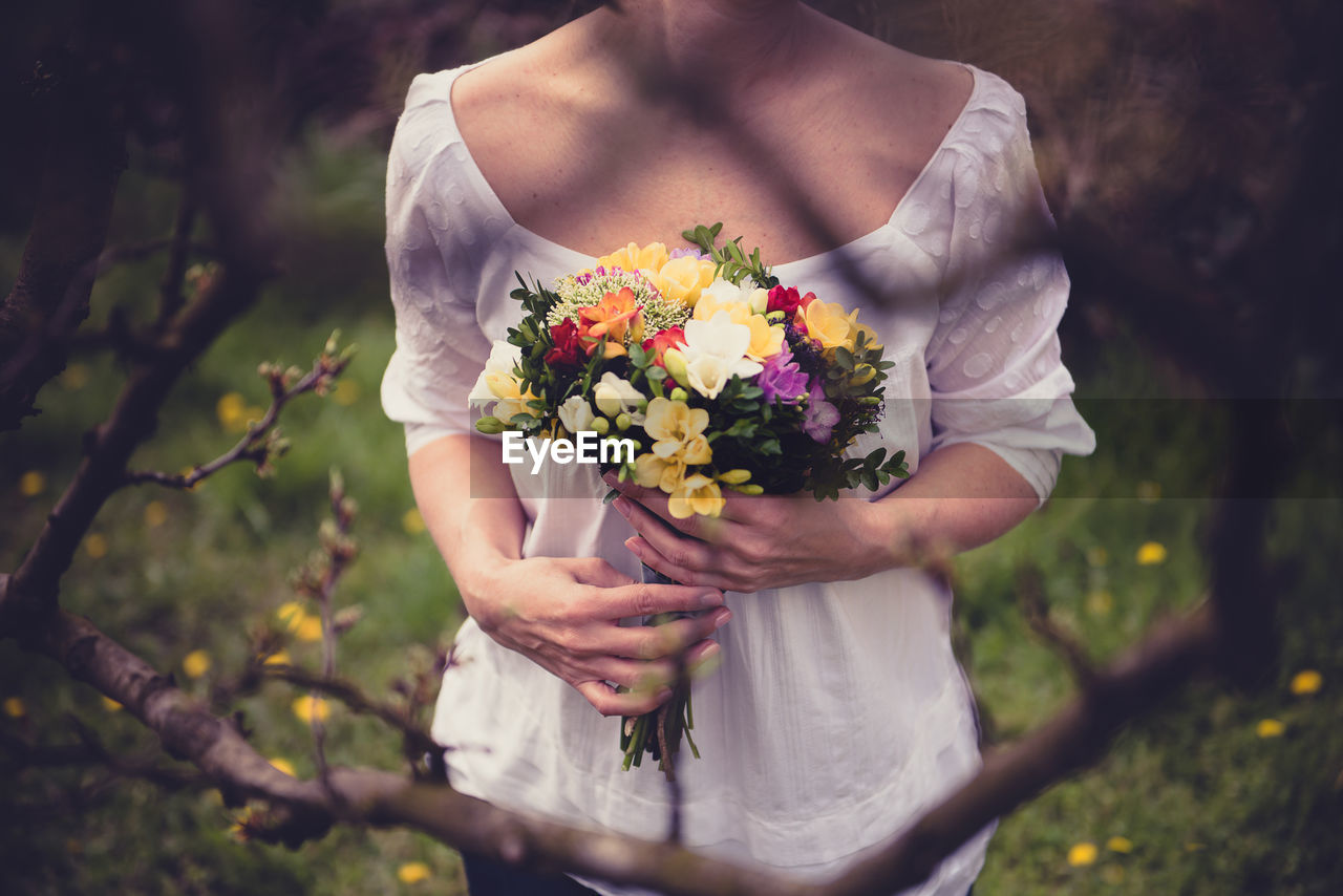 Close-up of girl holding flower