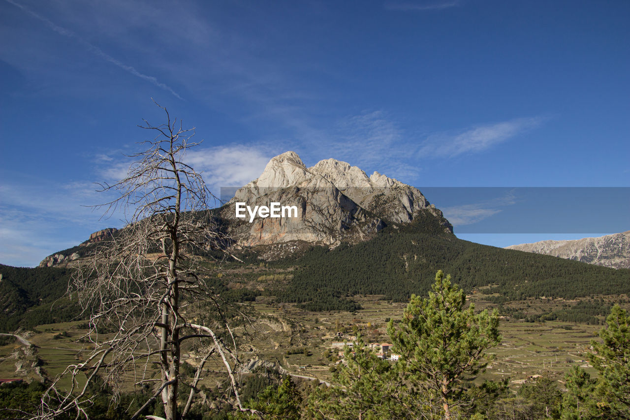 Scenic view of rocky mountains against sky