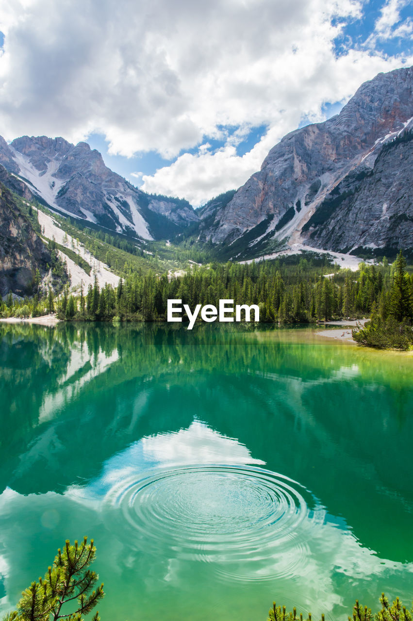 Scenic view of lake and mountains against sky