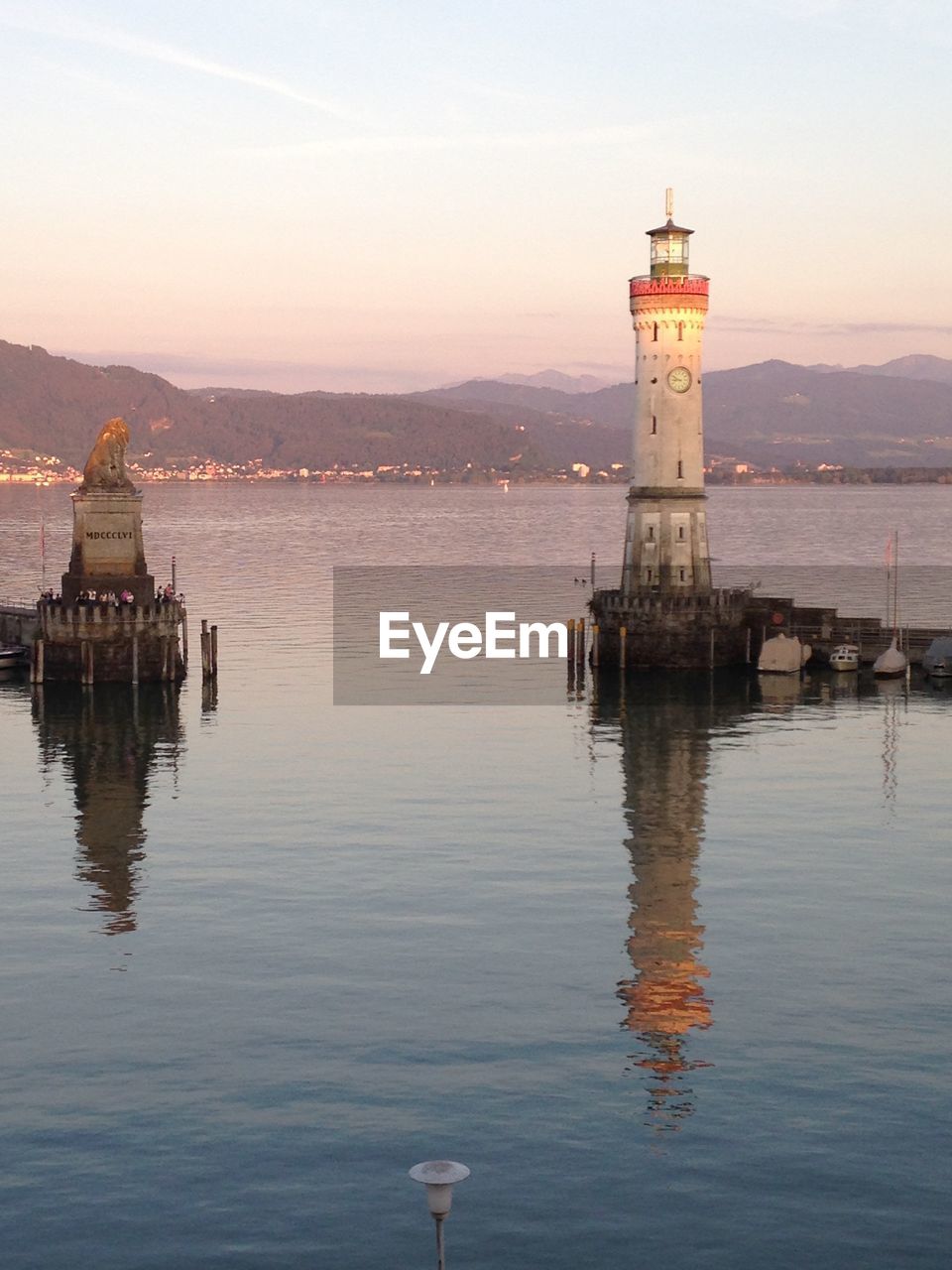 SCENIC VIEW OF SEA WITH MOUNTAIN IN BACKGROUND