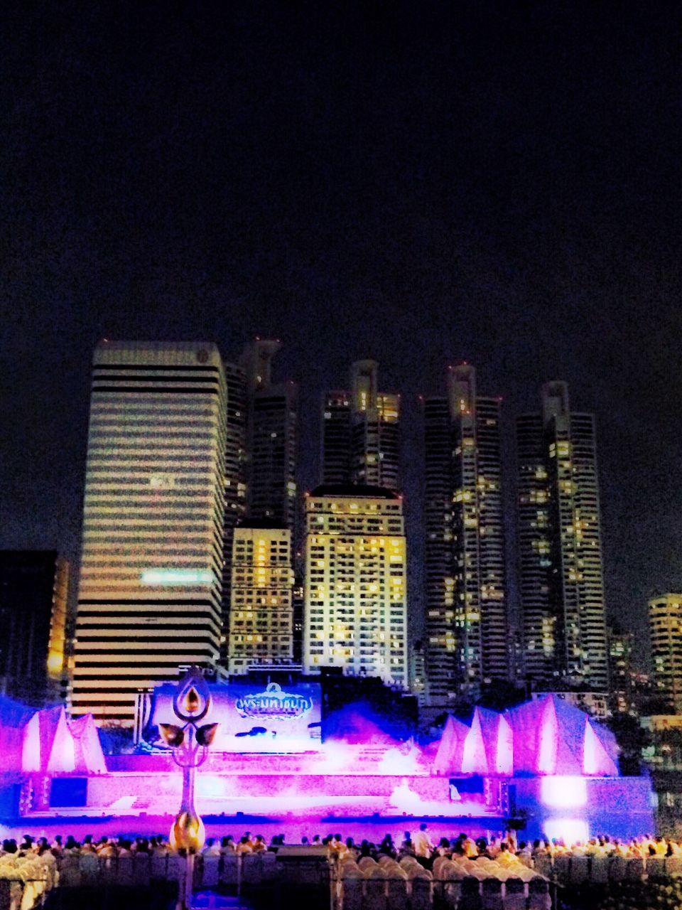 VIEW OF ILLUMINATED BUILDINGS AT NIGHT