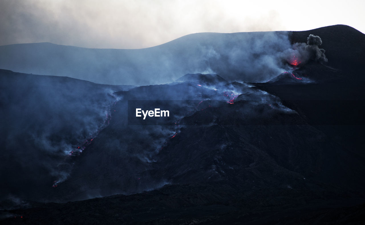 SMOKE EMITTING FROM VOLCANIC MOUNTAINS