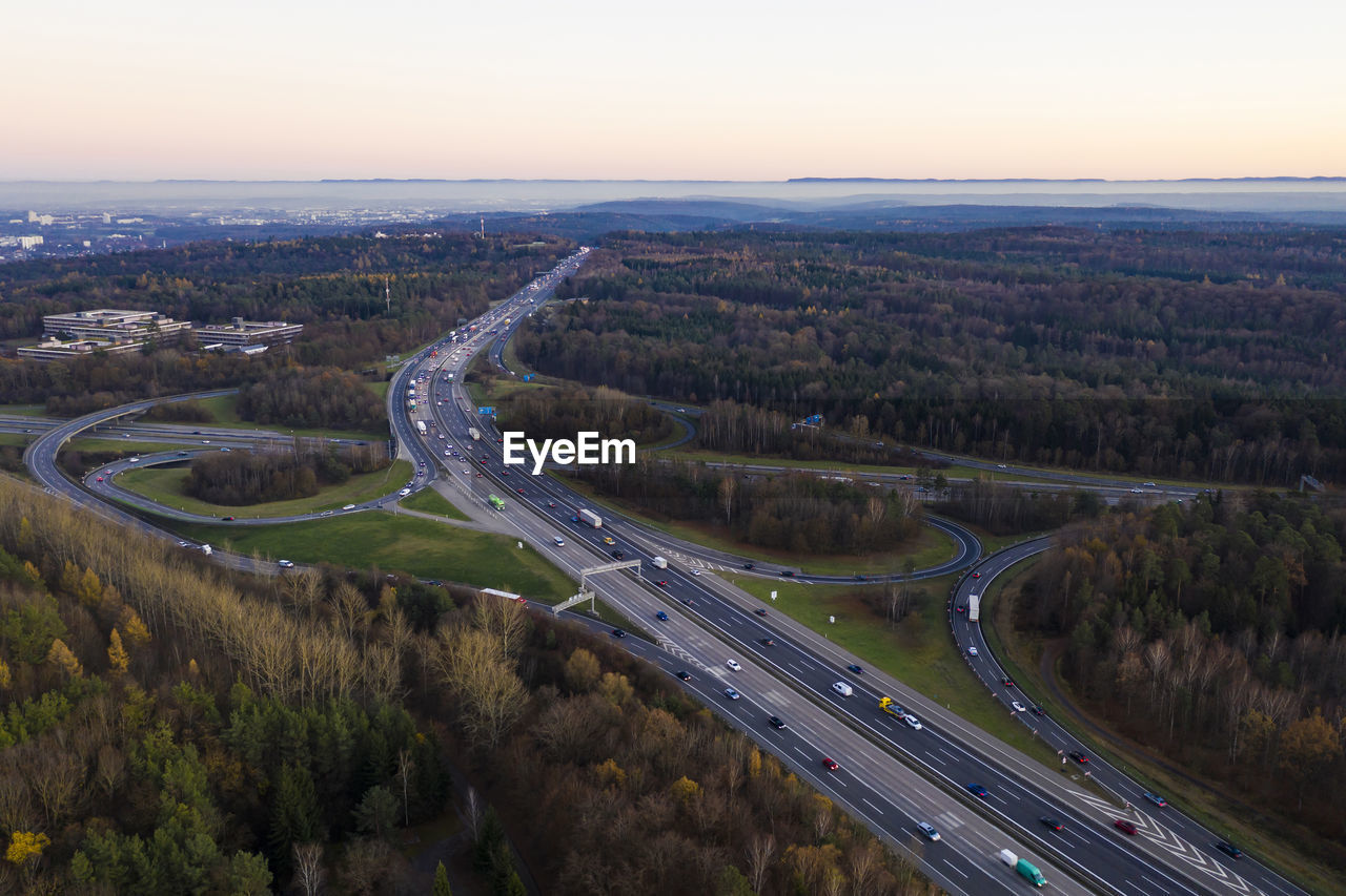 Germany, baden-wurttemberg, stuttgart, aerial view of traffic on bundesautobahn 8 at dusk