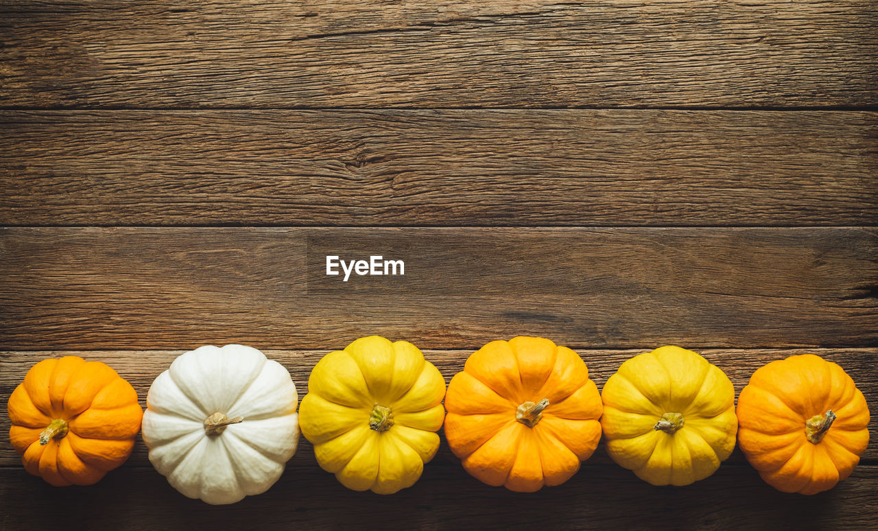 High angle view of pumpkins on table during autumn