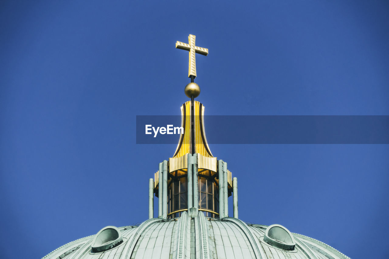 High section of church against clear blue sky