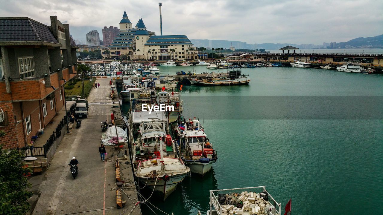 BOATS MOORED IN HARBOR