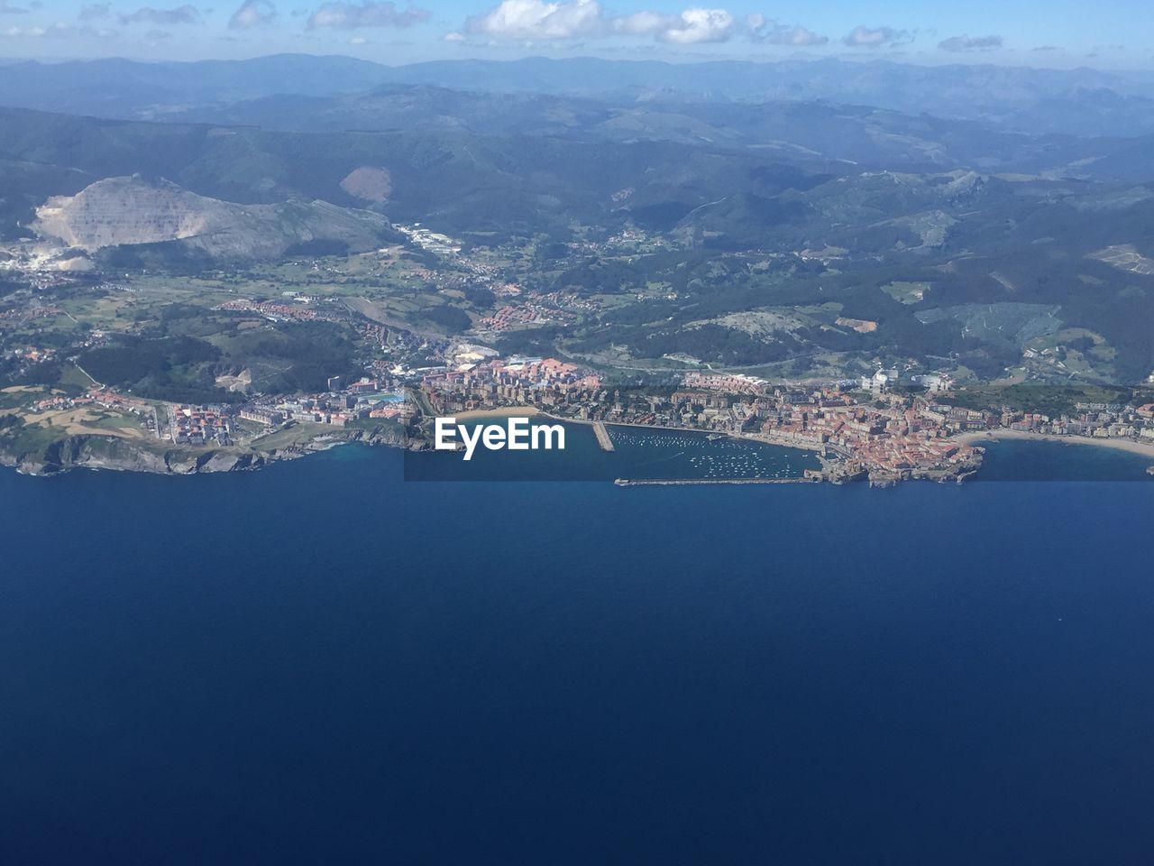 Aerial view of city against sky