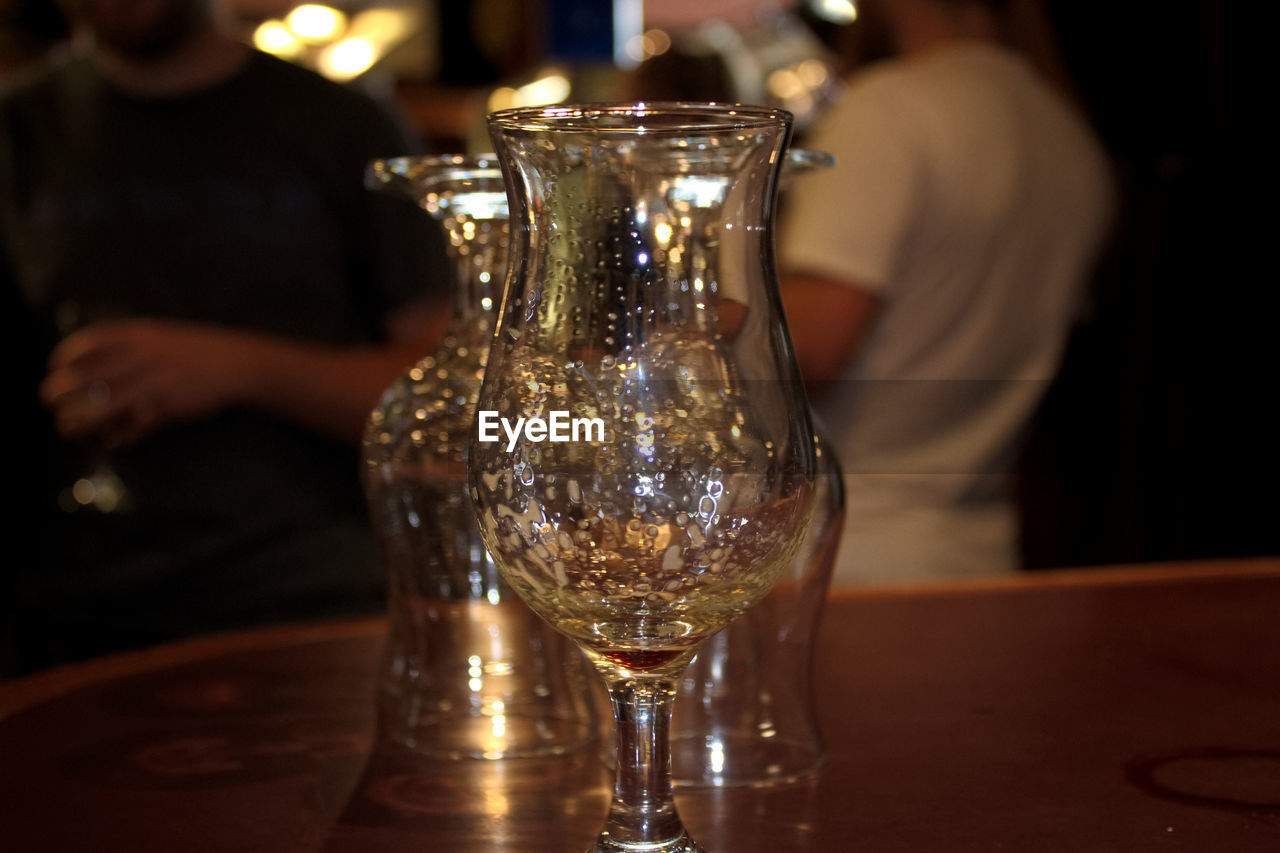 Close-up of wineglasses on table