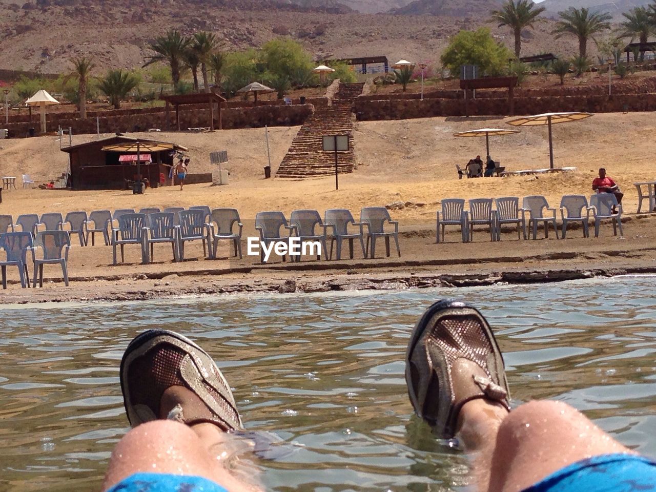 REAR VIEW OF MAN IN WATER