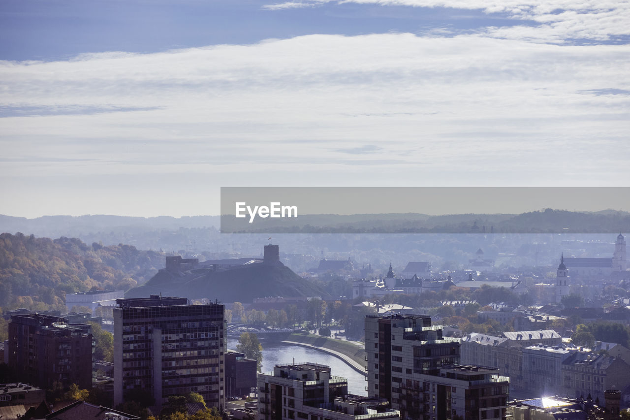 High angle view of buildings in city against sky