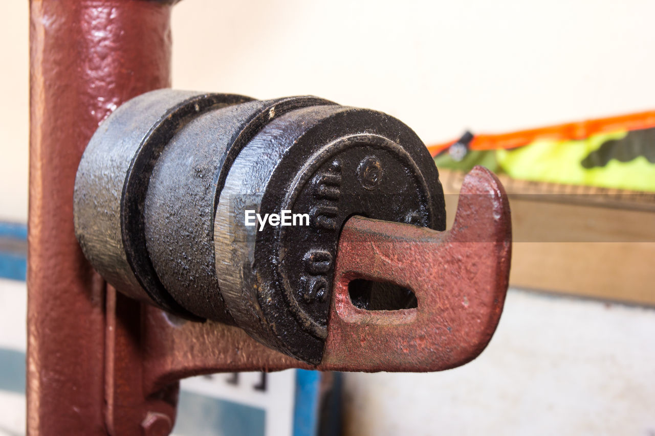 A short, antique mechanical or balance beam scale