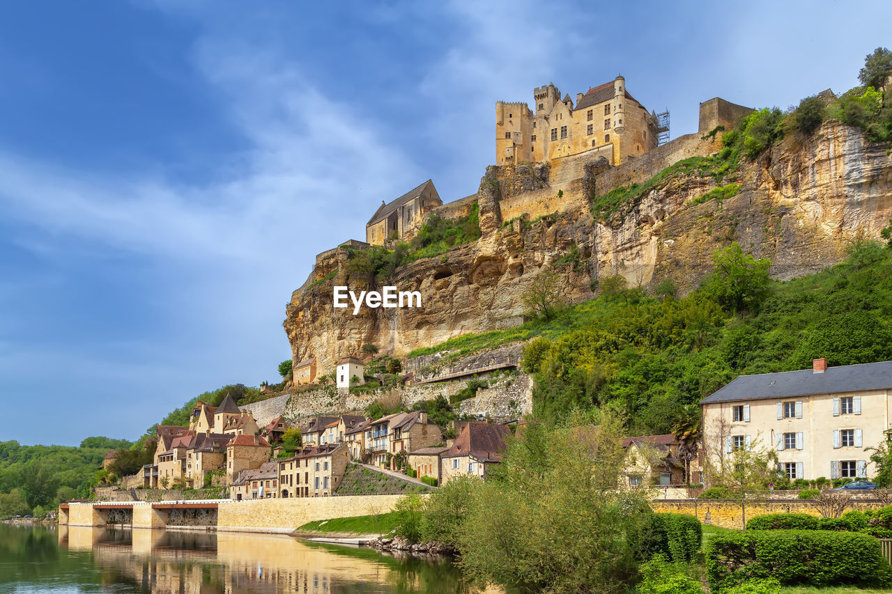 View of beynac-et-cazenac with castle on topof cliff, dordogne department, france