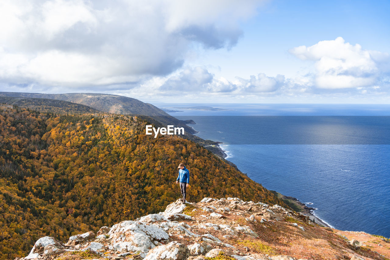 Man hiking blueberry mountain, cape breton island, nova scotia, canada