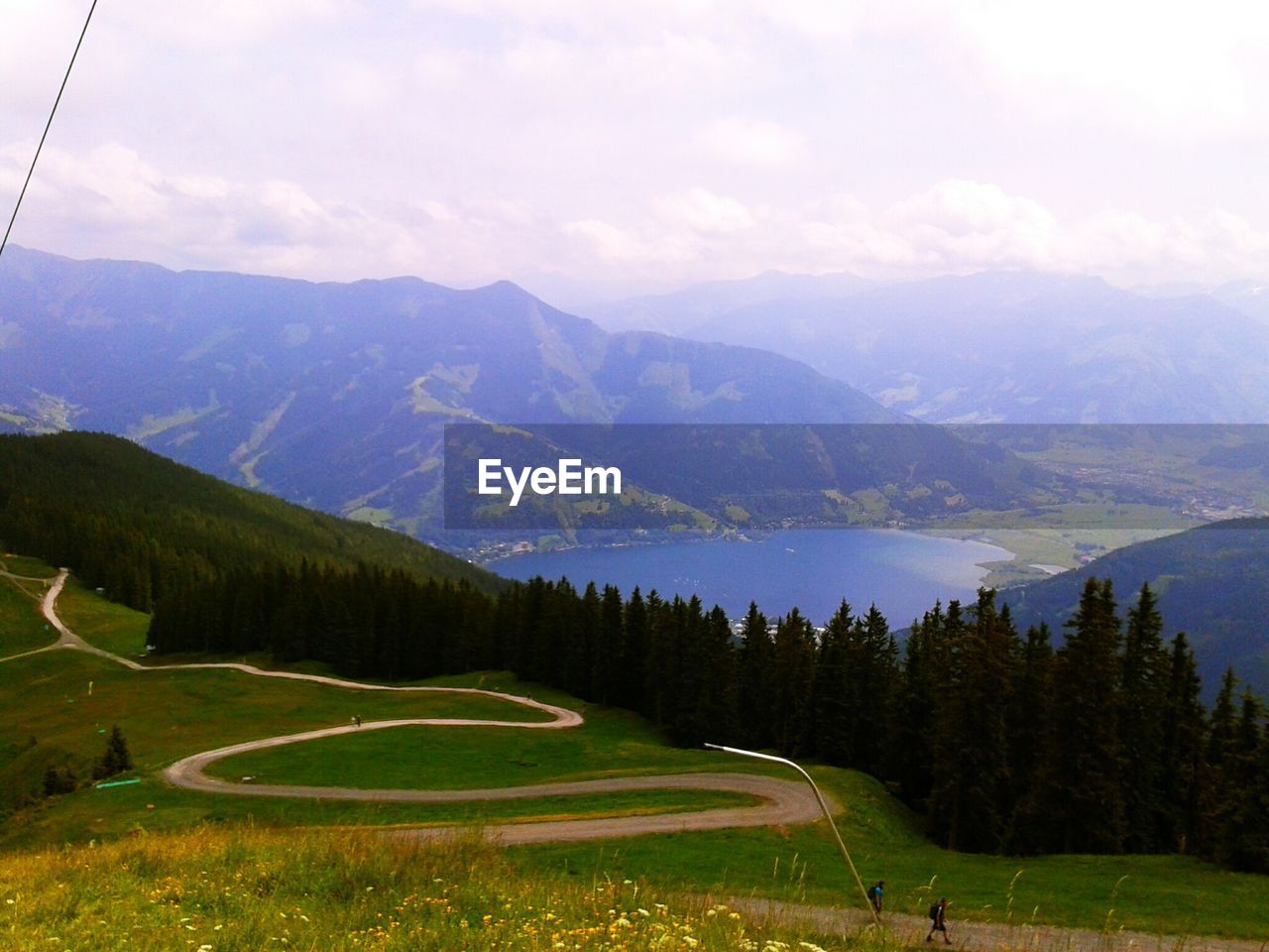 High angle view of mountains and lake against sky