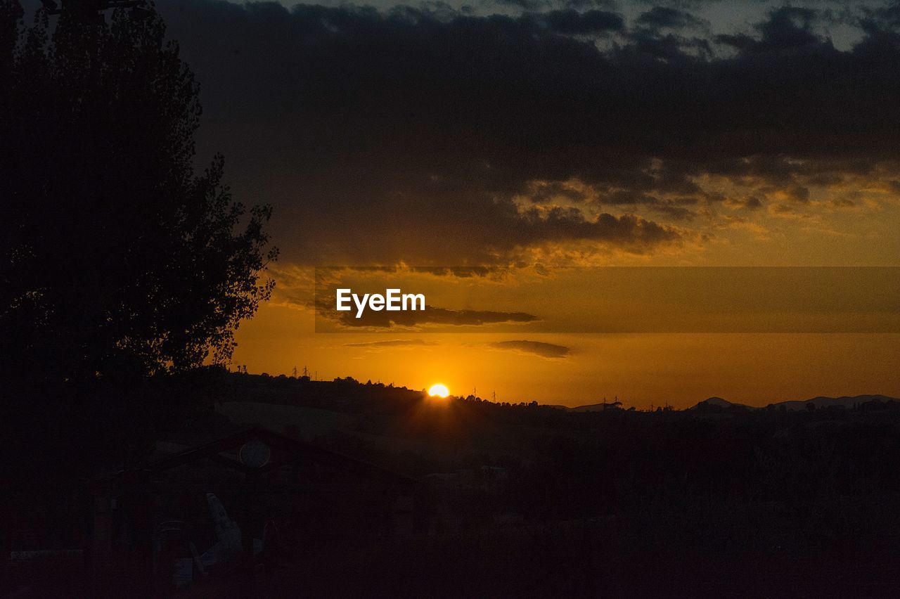 Scenic view of silhouette landscape against sky during sunset