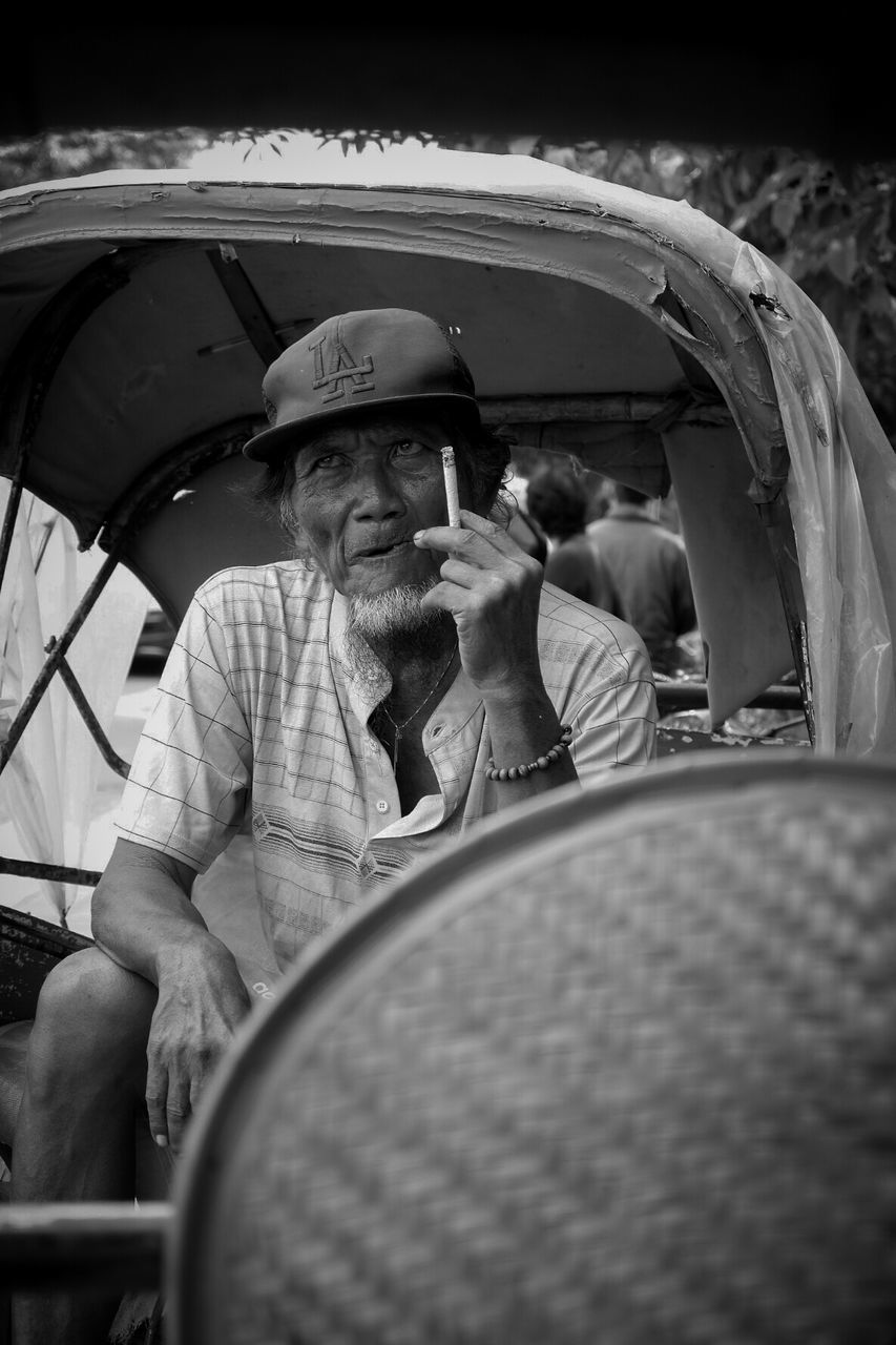 PEOPLE SITTING IN CAR