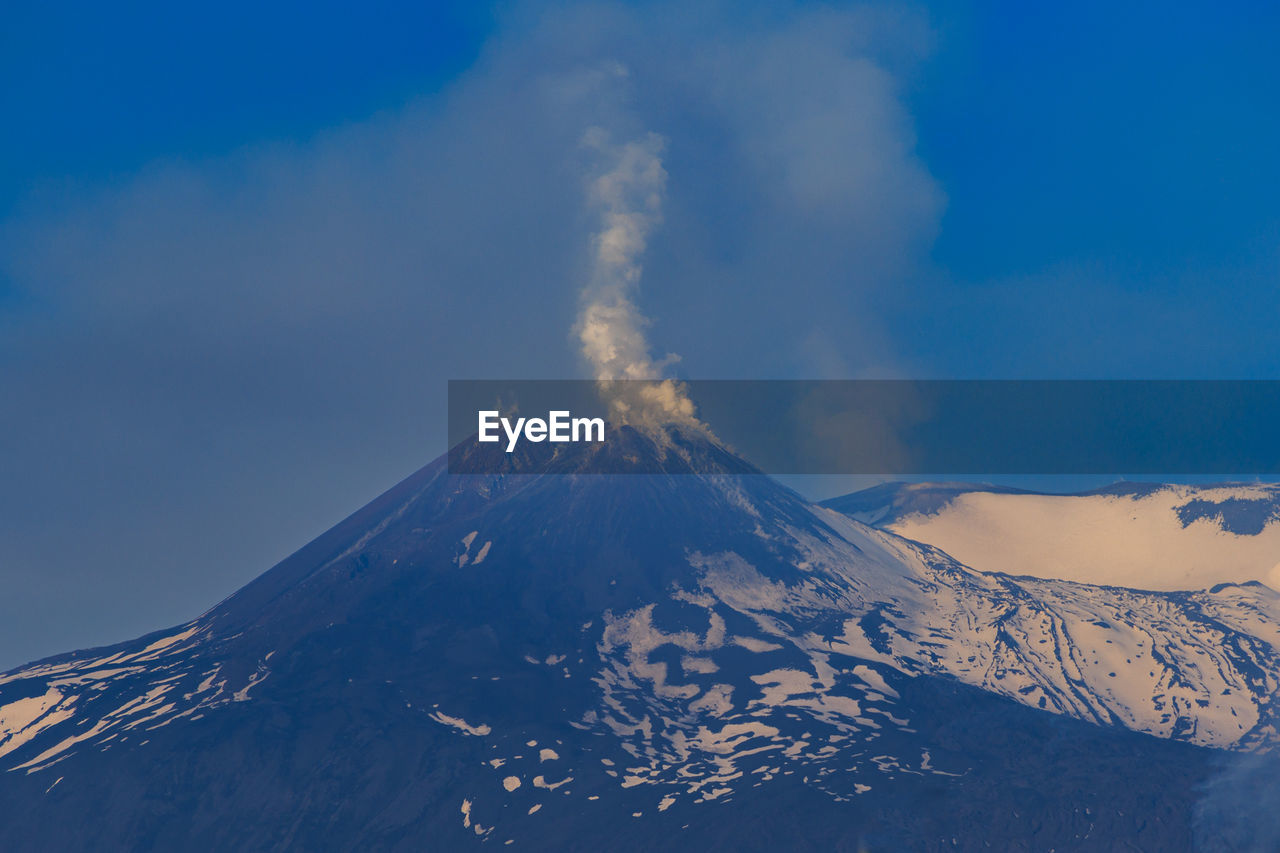 Scenic view of snowcapped etna volcano against sky